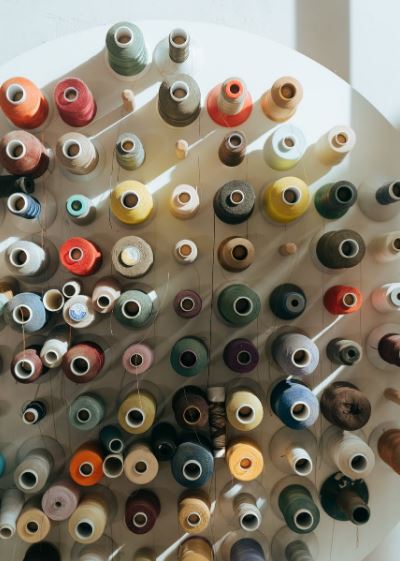 an overview of different colored sewing threads