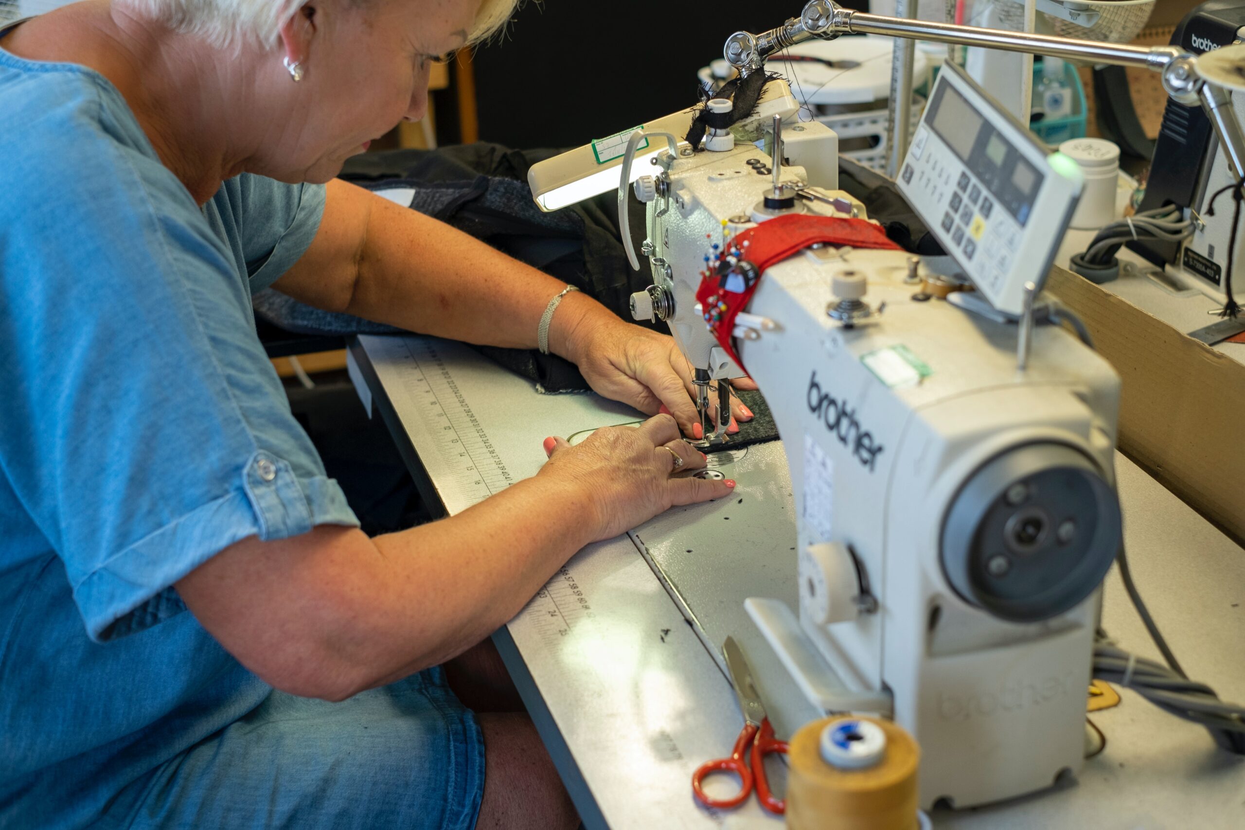 A woman using sewing machine