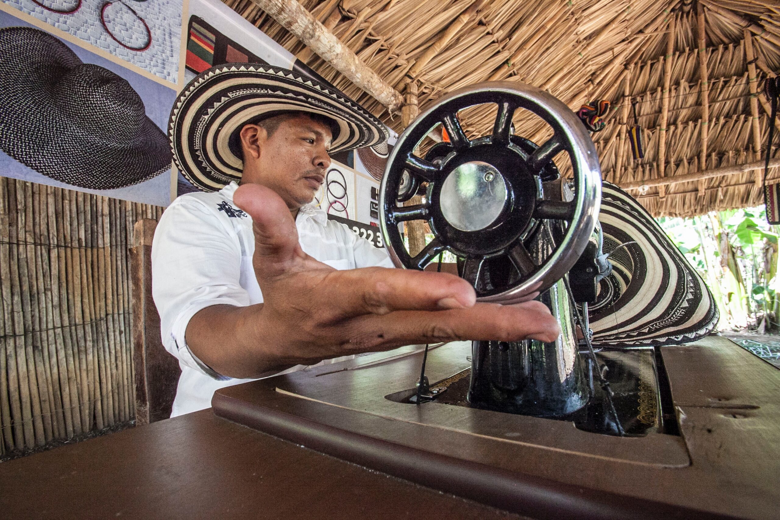 Man sitting in front of sewing machine