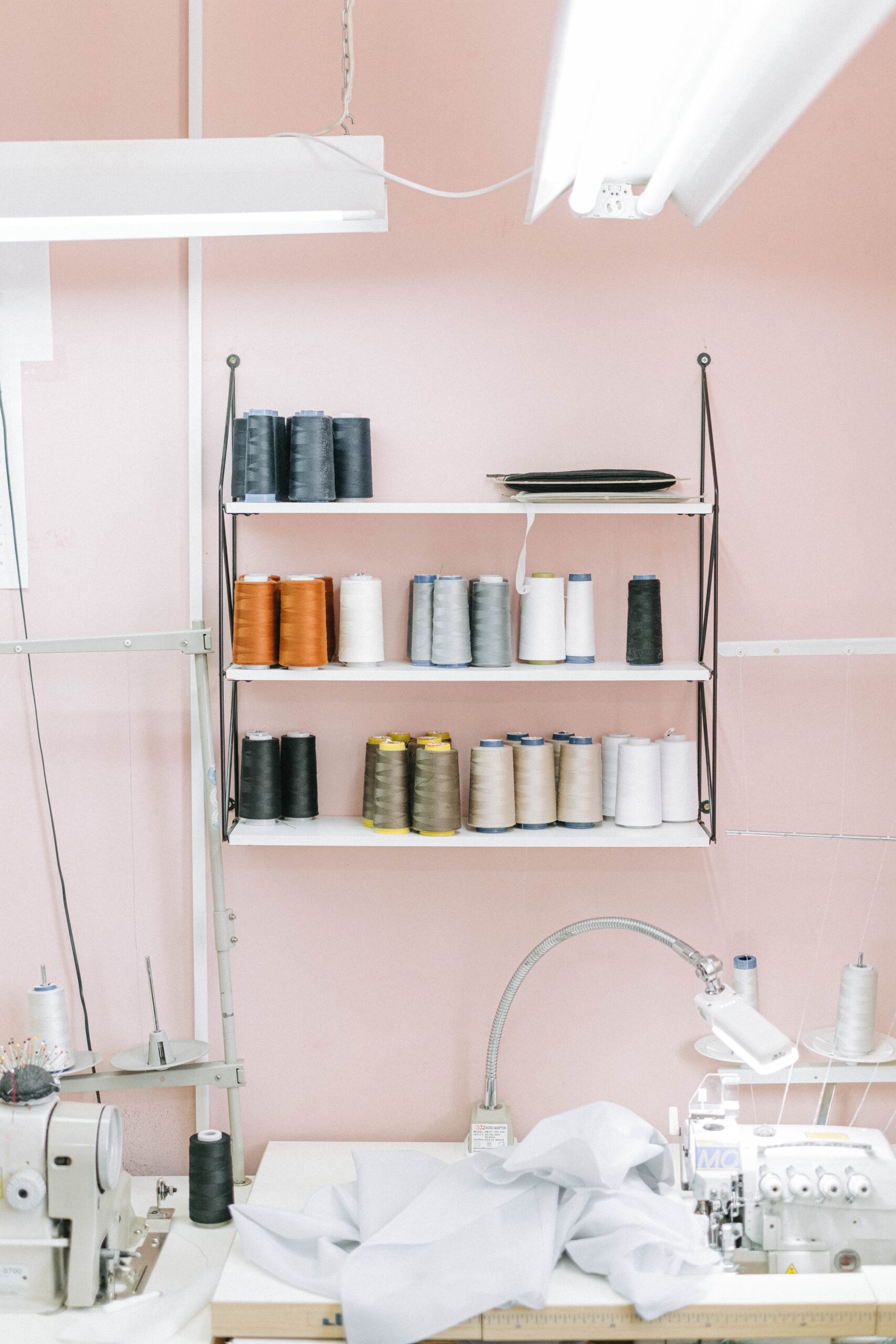 Sewing threads on wooden shelves