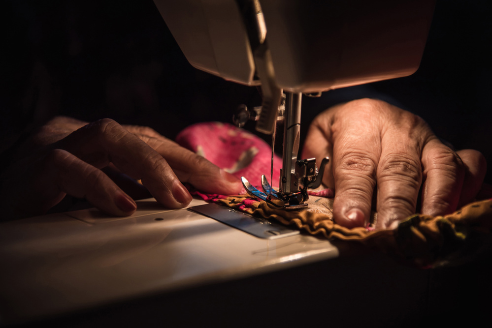 Close up of sewing machine on the table at night