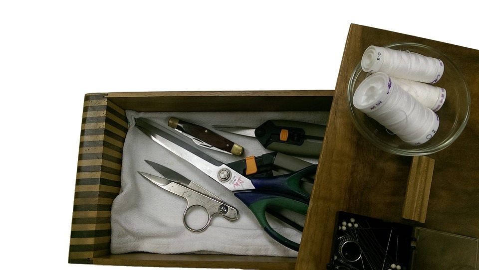 Shears, Scissors and thread in a wooden box
