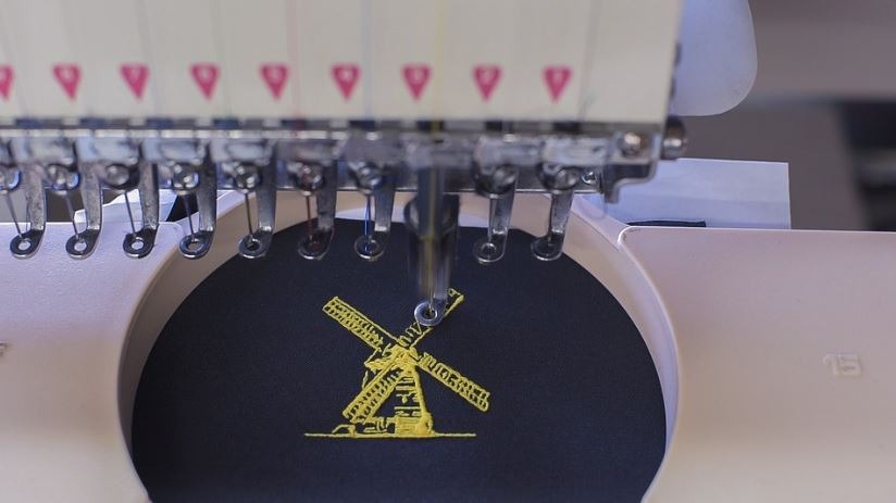 machine embroidering a tower mill