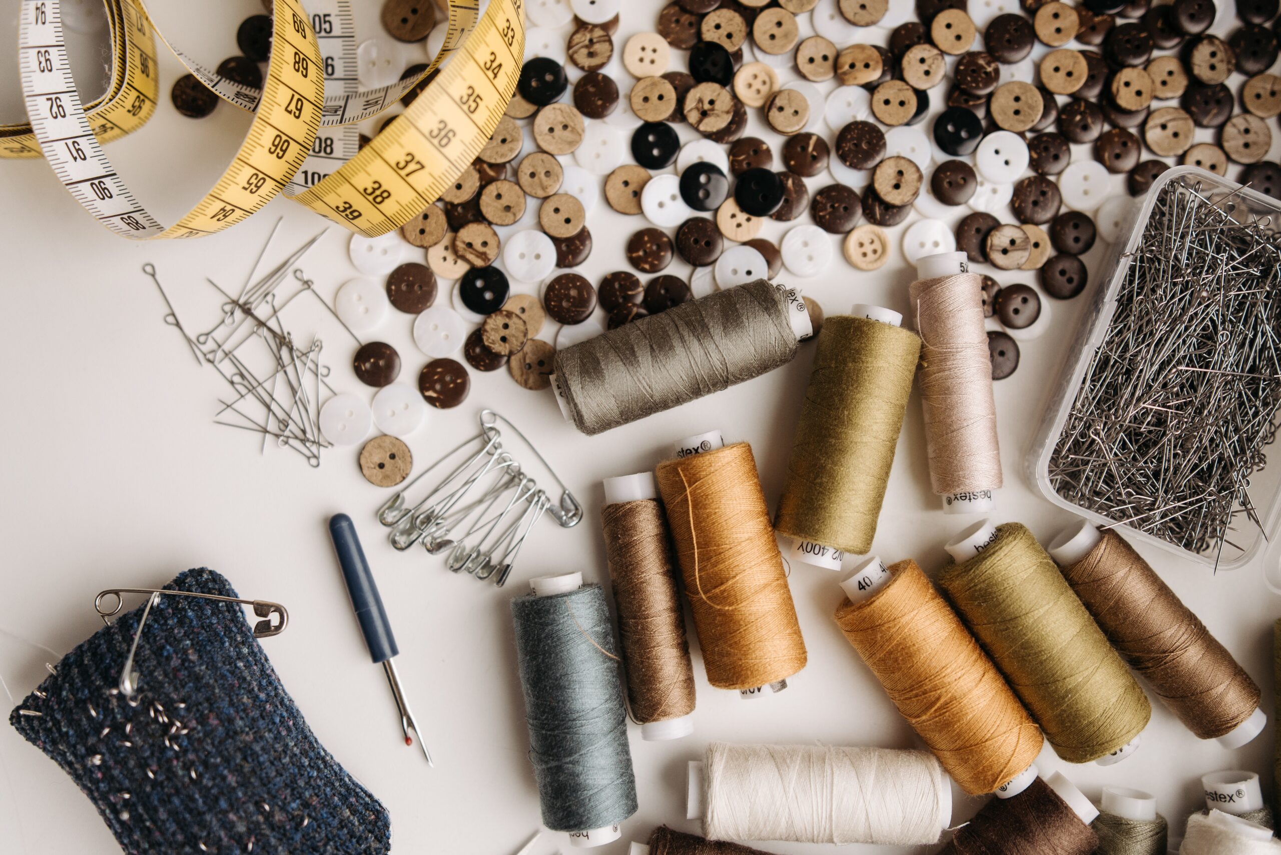 Buttons and sewing threads on the table